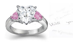 engagement ring three stone with heart diamond center and side pear pink sapphires