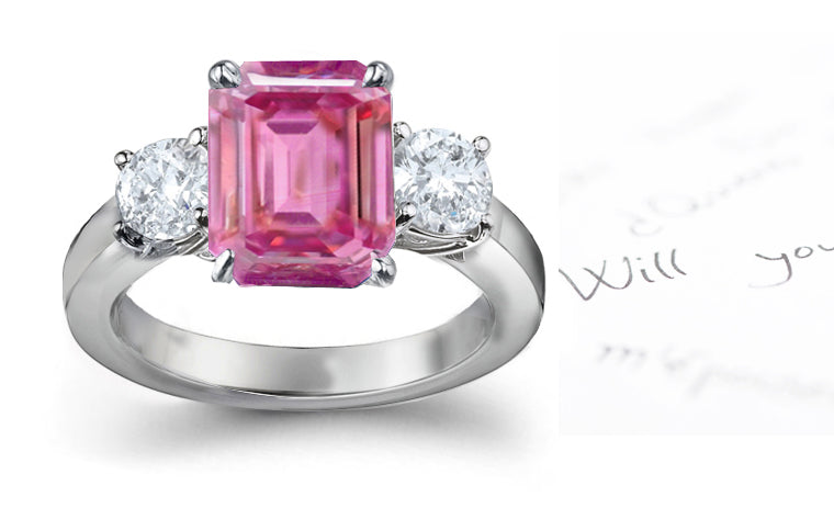 engagement ring with emerald cut pink sapphire center and side round diamonds