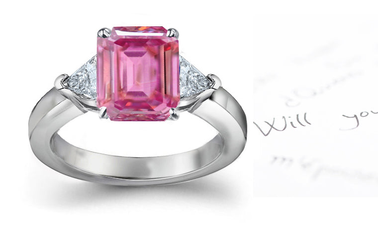 engagement ring with emerald cut pink sapphire center and side trillion diamonds