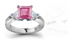 engagement ring with square pink sapphire center and side trillion diamonds