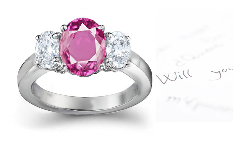 engagement ring three stone with oval pink sapphire center and side oval diamonds