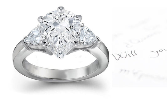 engagement ring three stone with pear shaped diamonds