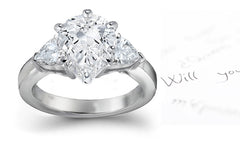 engagement ring three stone with pear shaped diamonds