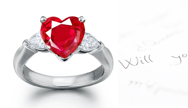 engagement ring three stone with heart ruby center and side pear white diamonds