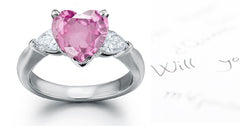 engagement ring three stone with heart pink sapphire center and side pear shaped diamonds