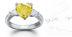 engagement ring three stone with yellow heart diamond center and side pear white diamonds