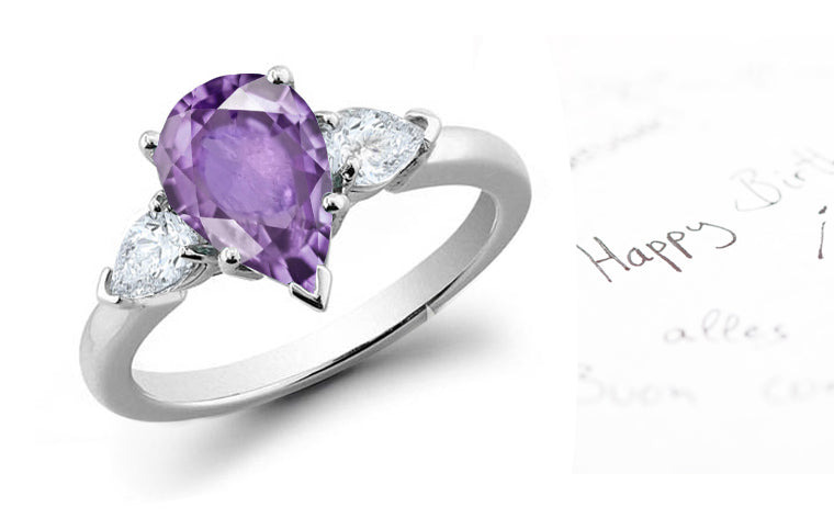 engagement ring with pear purple sapphire center stone and side pear diamonds