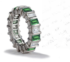 eternity ring handcrafted with bar set emerald cut emeralds and diamonds