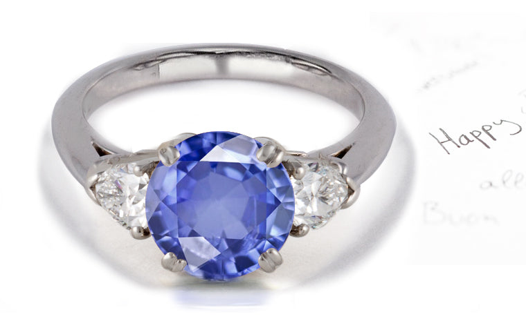 engagement ring three stone with round blue sapphire and trillion diamonds