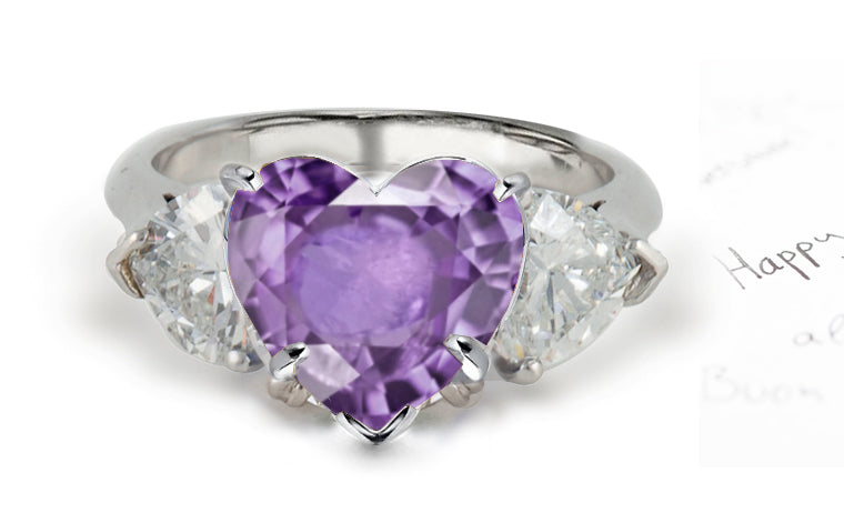 engagement ring three stone with heart purple sapphire center and side heart diamonds