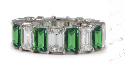 eternity ring prong set with emerald cut emeralds and diamonds