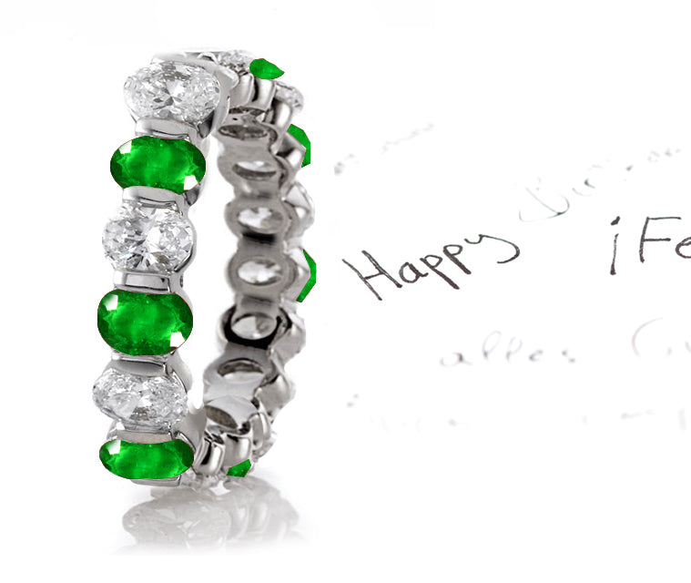 eternity ring handcrafted with alternating oval emeralds and diamonds