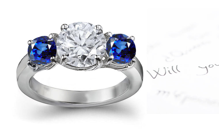 engagement ring three stone with round diamond and side round blue sapphires