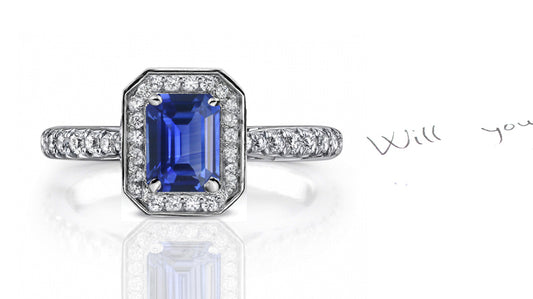 engagement ring handcrafted with emerald cut blue sapphire center and diamond halo/band