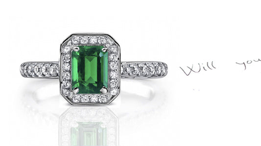 engagement ring handcrafted with emerald cut emerald center and diamond halo/band