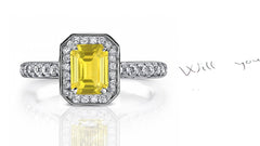 engagement ring handcrafted with emerald cut yellow sapphire center and diamond halo/band