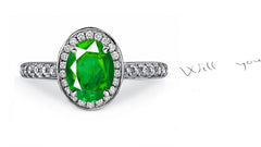 engagement ring handcrafted with oval emerald center and diamond halo/band