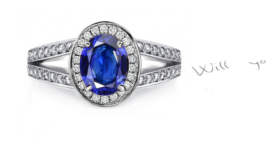 engagement ring handcrafted with oval blue sapphire center in a diamond halo/band