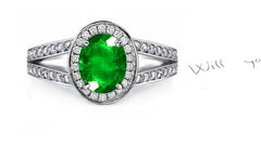 engagement ring handcrafted with oval emerald and diamond halo/band