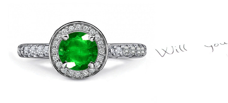 engagement ring with round emerald and diamond halo and band