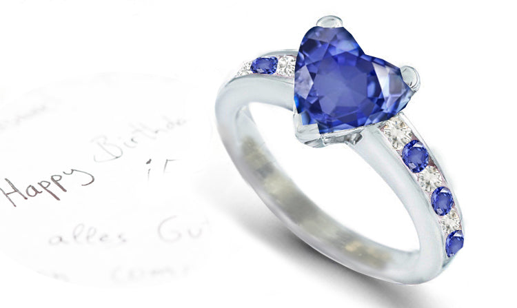 engagement ring with heart blue sapphire center and side round blue sapphires and diamonds