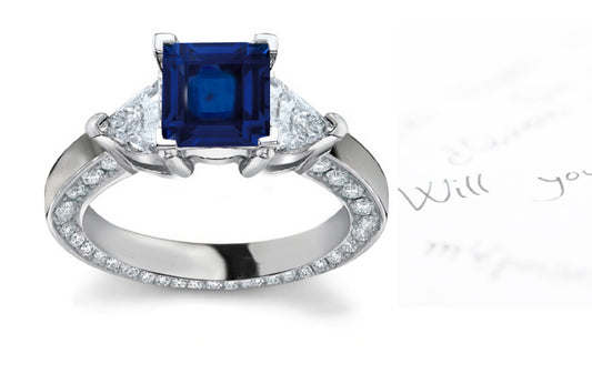 engagement ring with square blue sapphire center and diamond accents band