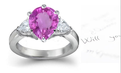 engagement ring with pear pink sapphire center and site pear white diamonds