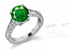 engagement ring with round emerald center and diamond accents band