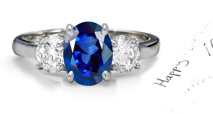 engagement ring three stone with oval blue sapphire and side oval diamonds