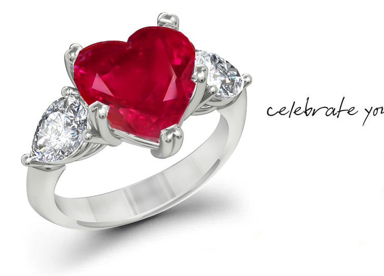 engagement ring three stone with heart ruby center and side pear white diamonds