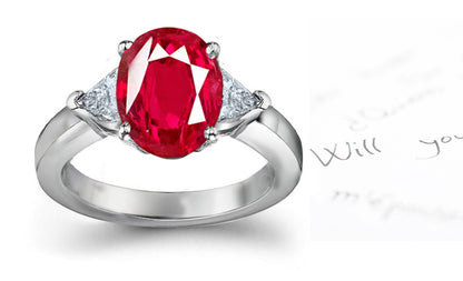 engagement ring three stone with oval ruby and side trillion diamonds